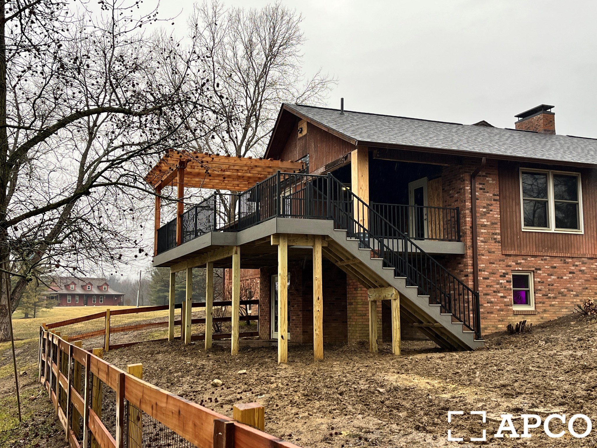 Custom-built elevated deck with railings and pergola