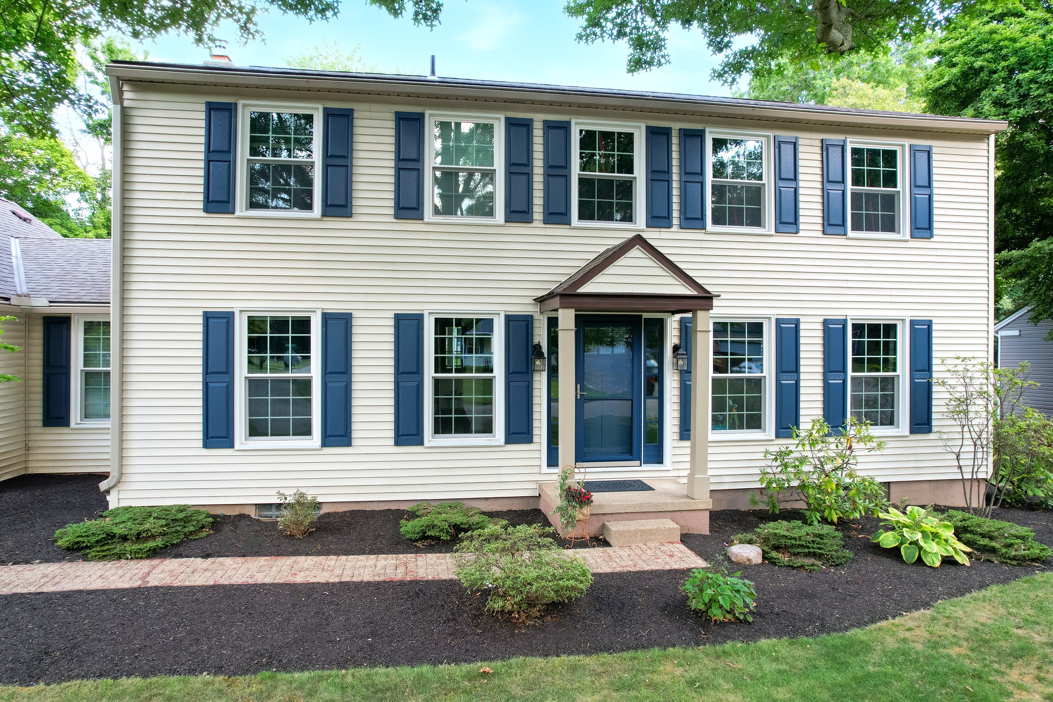 Completed siding installation on a two-storey home